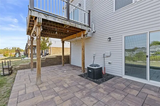 a view of a patio with table and chairs