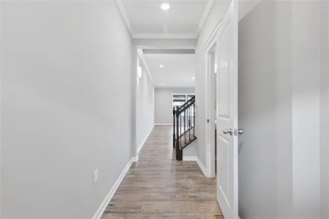 a view of a hallway with the wooden floor