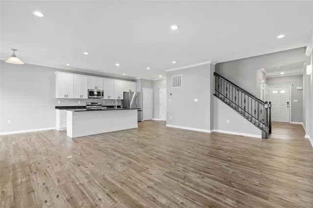 a view of kitchen with wooden floor