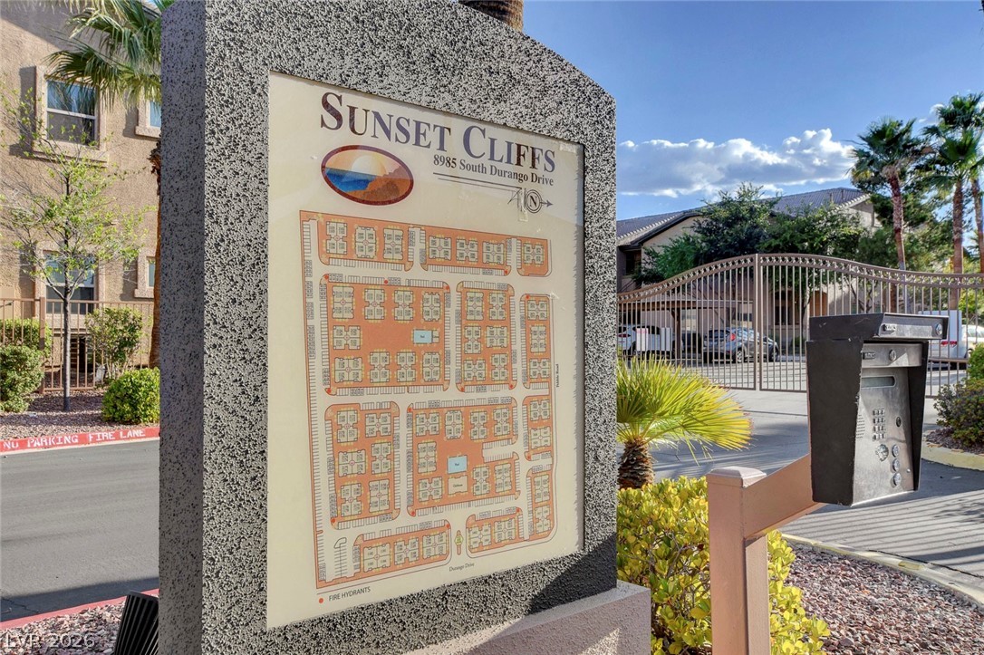 8985 South Durango Drive, Unit 2187 Las Vegas, NV 89113 - Photo 59 of 73 A well-maintained community entrance features a detailed map and secure gated access, enhancing resident privacy and convenience.