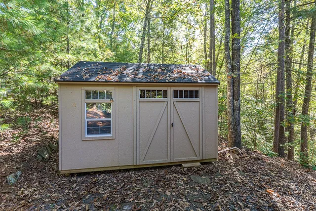 a wooden door in front of a house