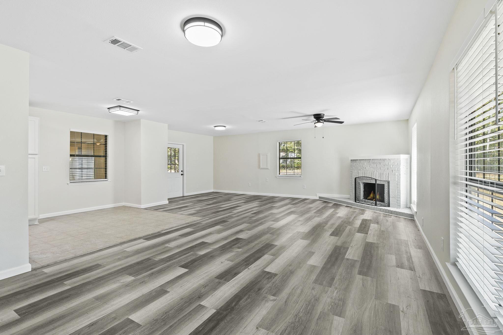 4200 Rigby Road Century, FL 32535 - Photo 2 of 71 a view of empty room with windows and fireplace