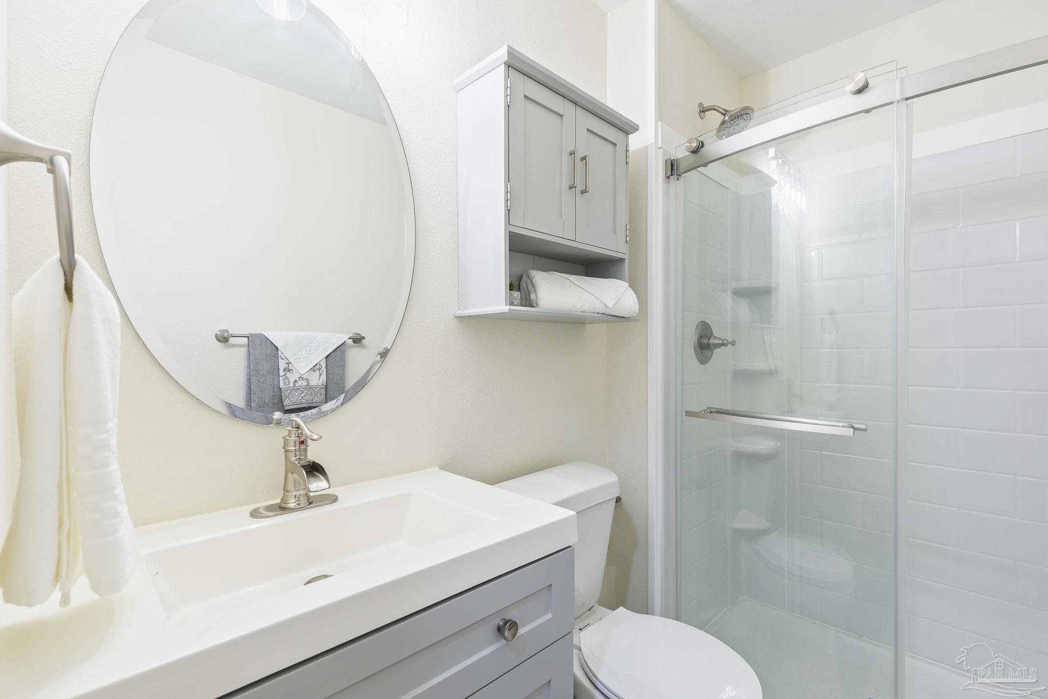 4200 Rigby Road Century, FL 32535 - Photo 26 of 71 a bathroom with a sink toilet and shower