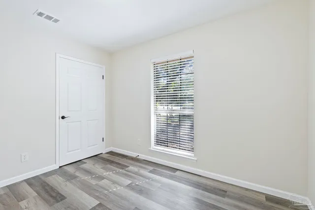 a backyard of a house with lots of green space