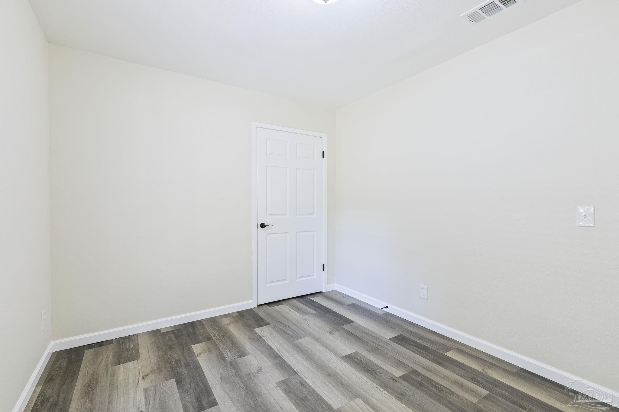 4200 Rigby Road Century, FL 32535 - Photo 36 of 71 a view of room with wooden floor