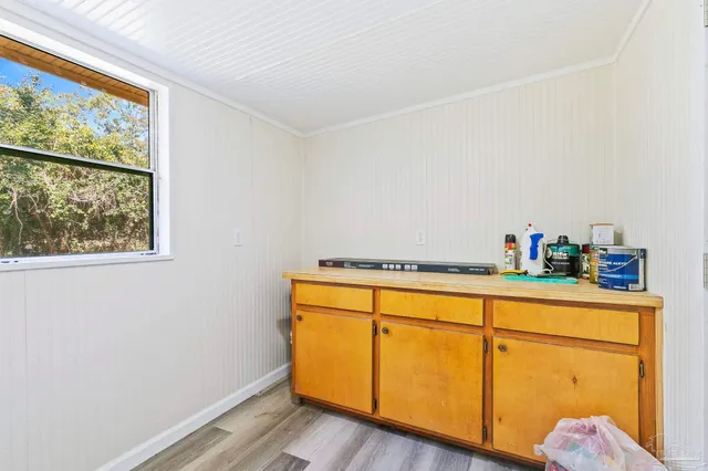 a view of a pathway both side of house