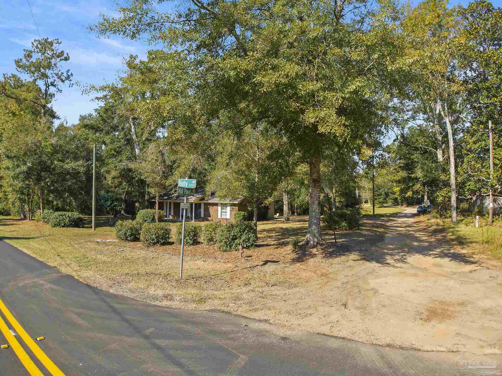 4200 Rigby Road Century, FL 32535 - Photo 42 of 71 a view of a yard with plants and trees