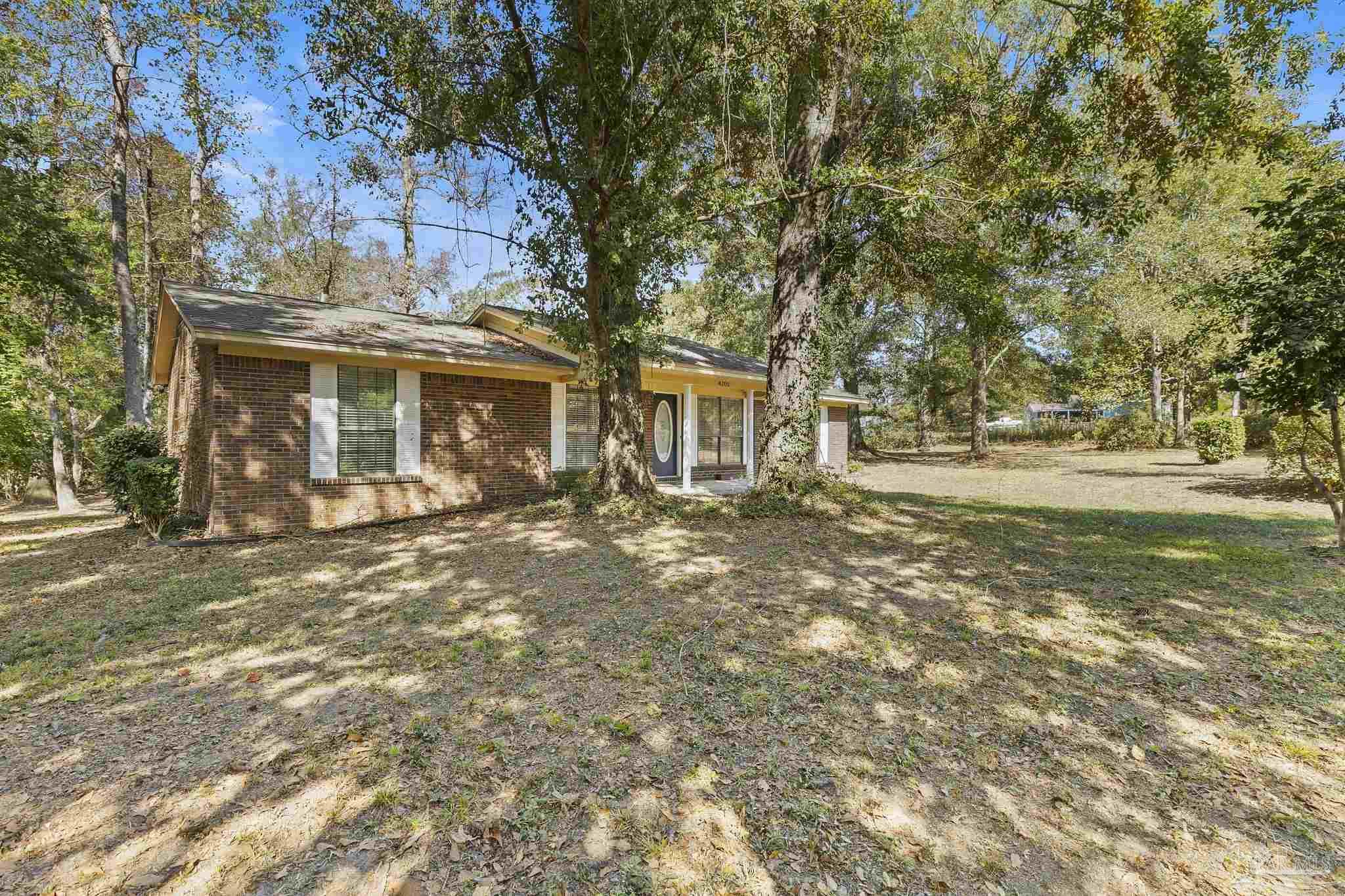 4200 Rigby Road Century, FL 32535 - Photo 44 of 71 front view of a house with a yard