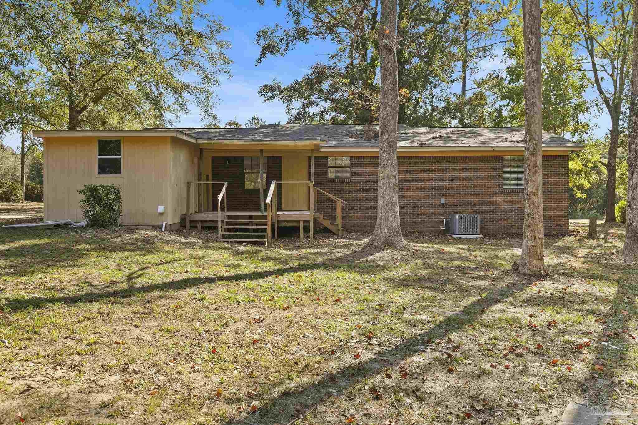 4200 Rigby Road Century, FL 32535 - Photo 47 of 71 front view of a house with a yard