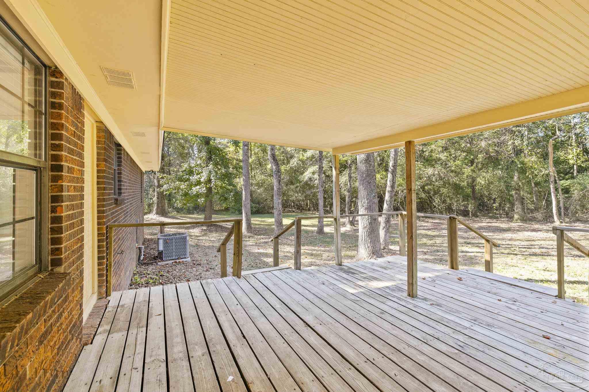 4200 Rigby Road Century, FL 32535 - Photo 52 of 71 a view of balcony with wooden floor and fence