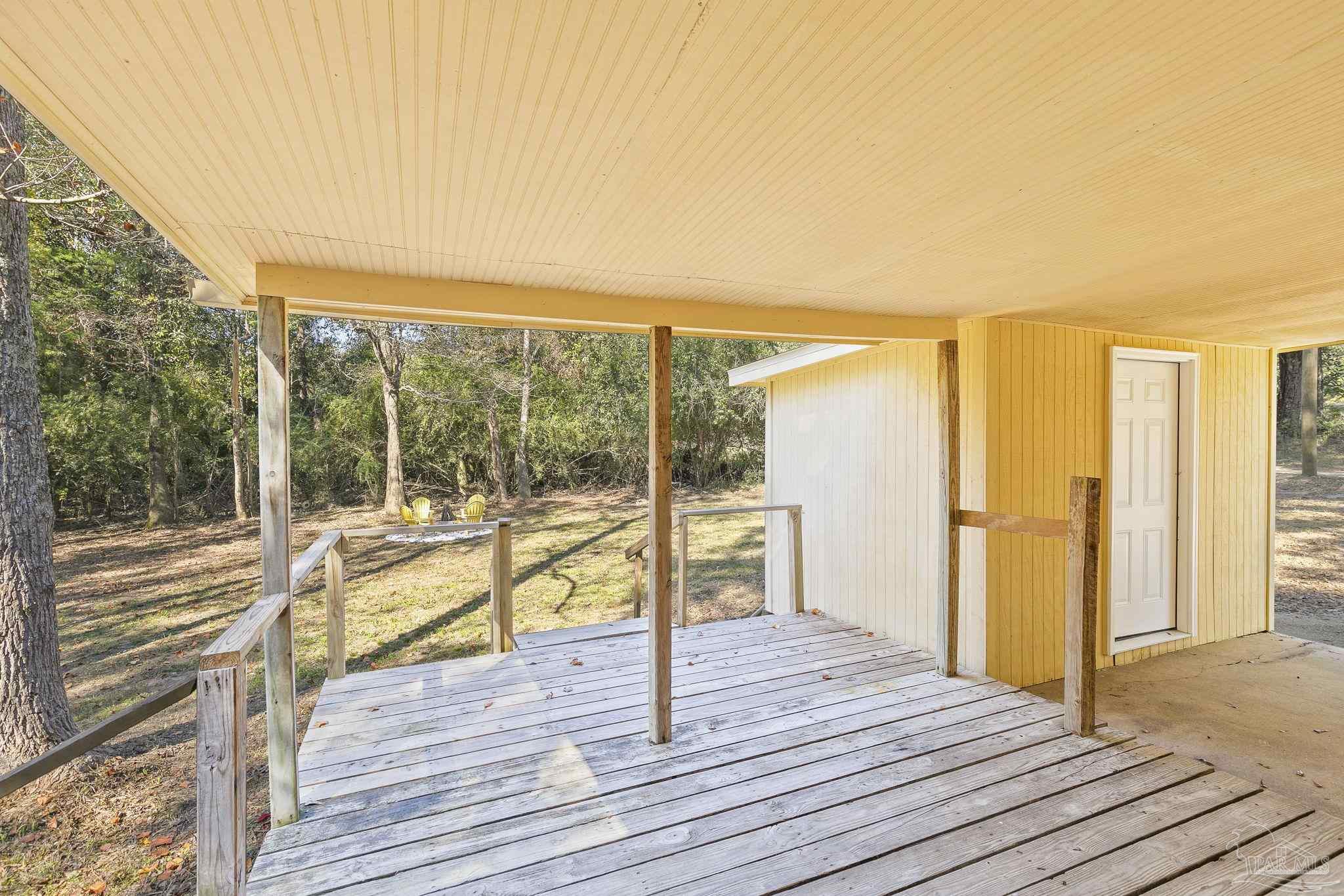 4200 Rigby Road Century, FL 32535 - Photo 53 of 71 a view of a balcony with wooden floor and fence