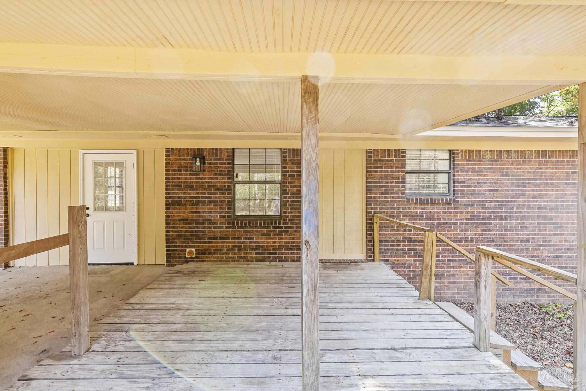 4200 Rigby Road Century, FL 32535 - Photo 54 of 71 a view of a balcony with wooden floor