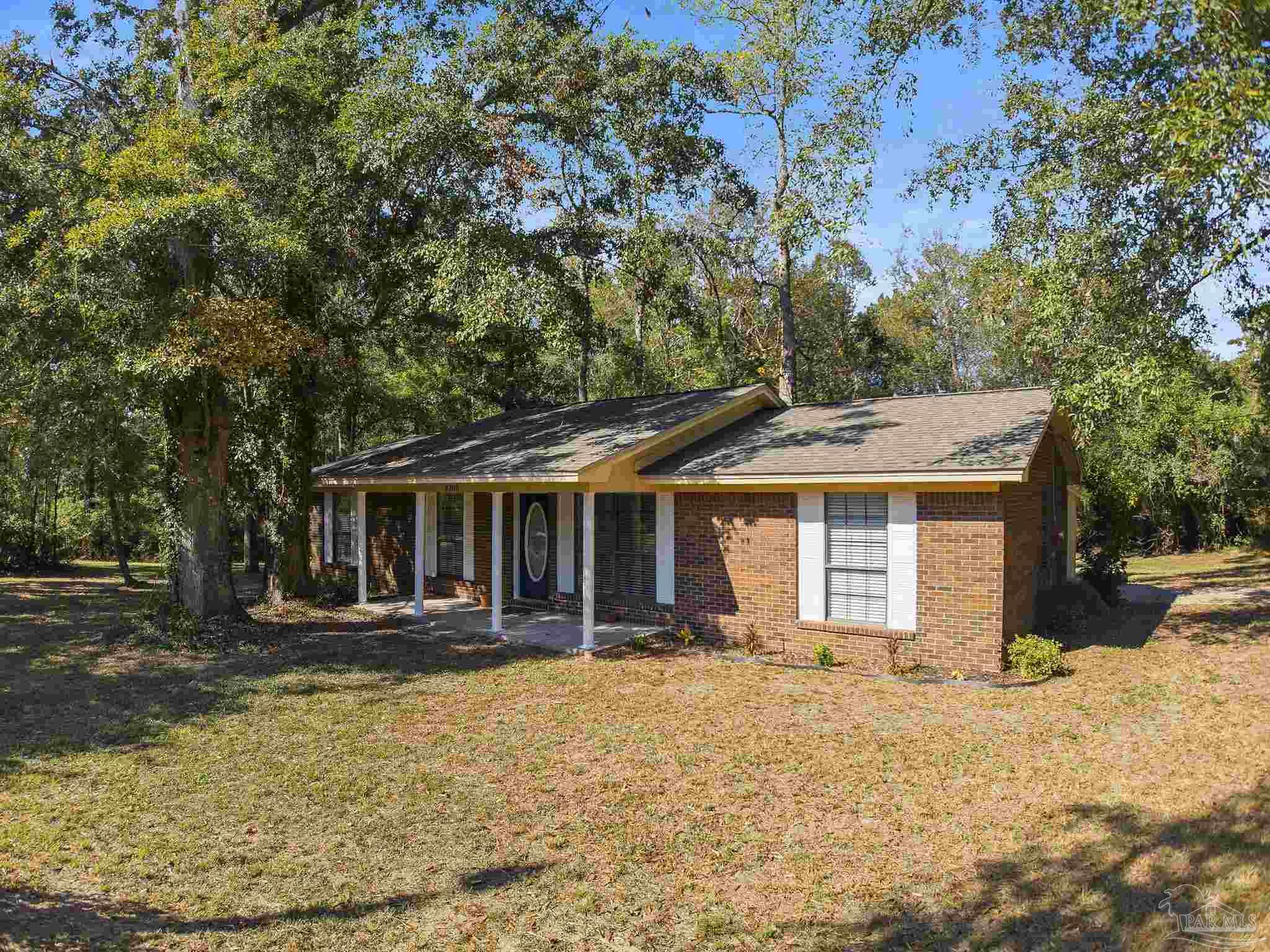 4200 Rigby Road Century, FL 32535 - Photo 61 of 71 front view of a house with a yard