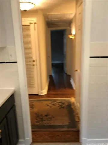 a bathroom with a large mirror and a shower