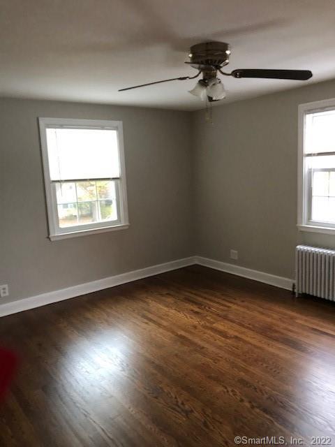 66 Hillandale Road, Unit 2 Fairfield, CT 06825 - Photo 15 of 33 a view of a room with wooden floor and a window