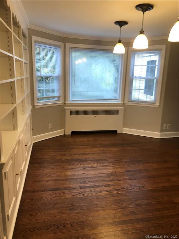 66 Hillandale Road, Unit 2 Fairfield, CT 06825 - Photo 21 of 33 a view of room with window and wooden floor