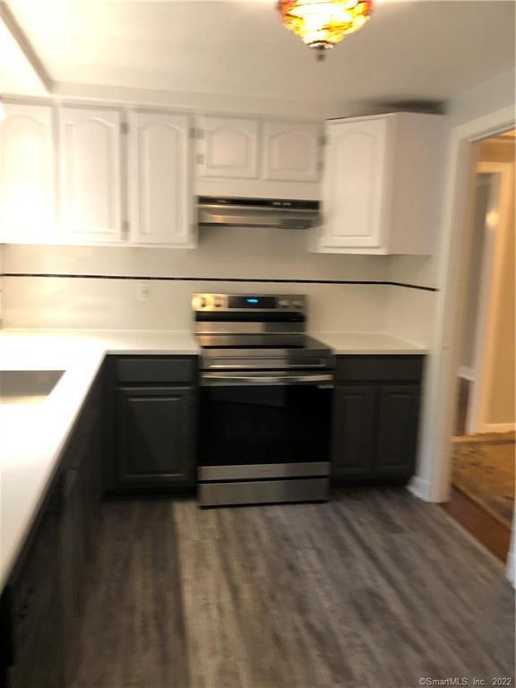66 Hillandale Road, Unit 2 Fairfield, CT 06825 - Photo 10 of 33 a kitchen with a stove and a refrigerator