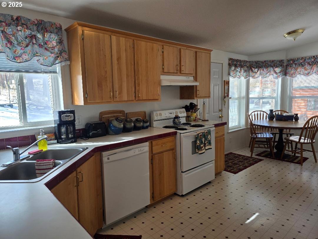 232 South Oak Road Wamic, OR 97063 - Photo 15 of 31 a kitchen with a cabinets a sink and appliances