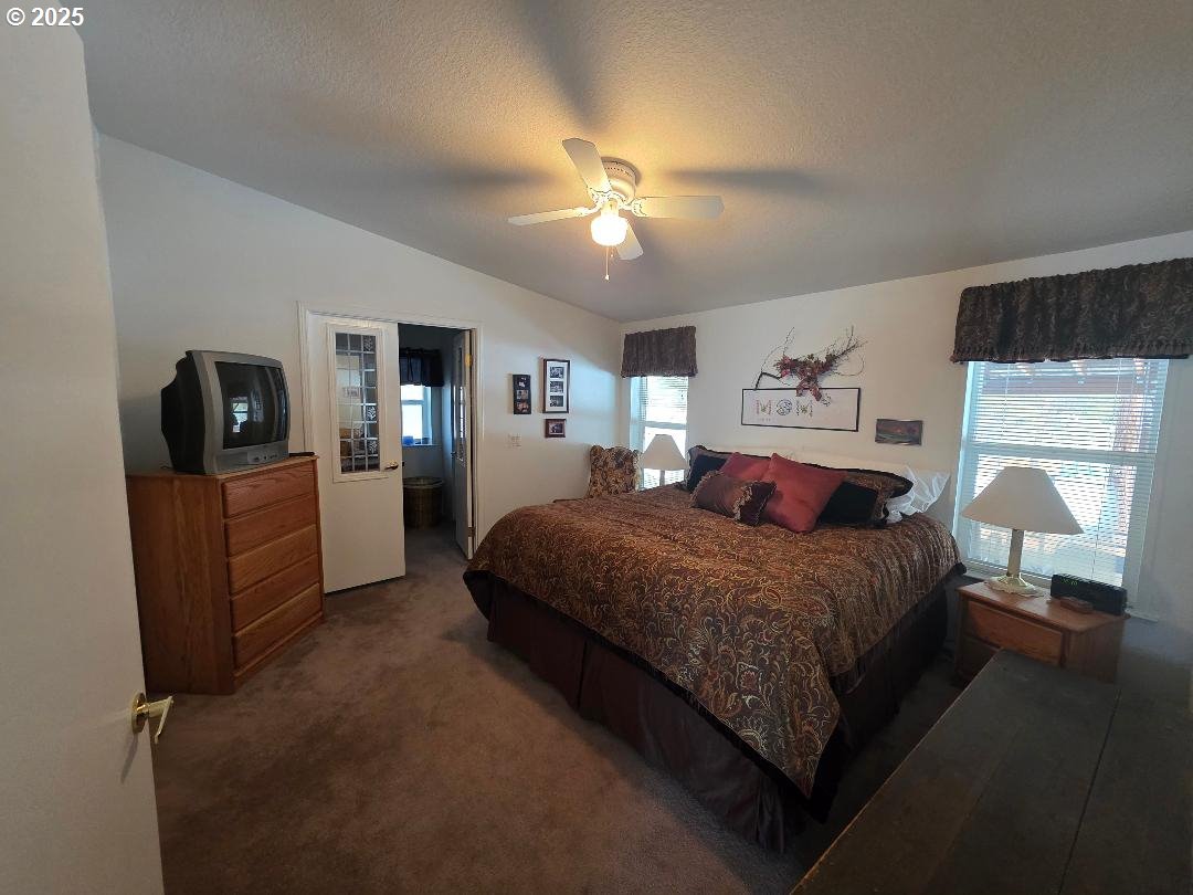 232 South Oak Road Wamic, OR 97063 - Photo 23 of 31 a bedroom with a bed and a television