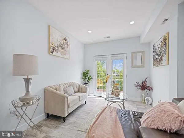 a spacious bedroom with a bed and a couch