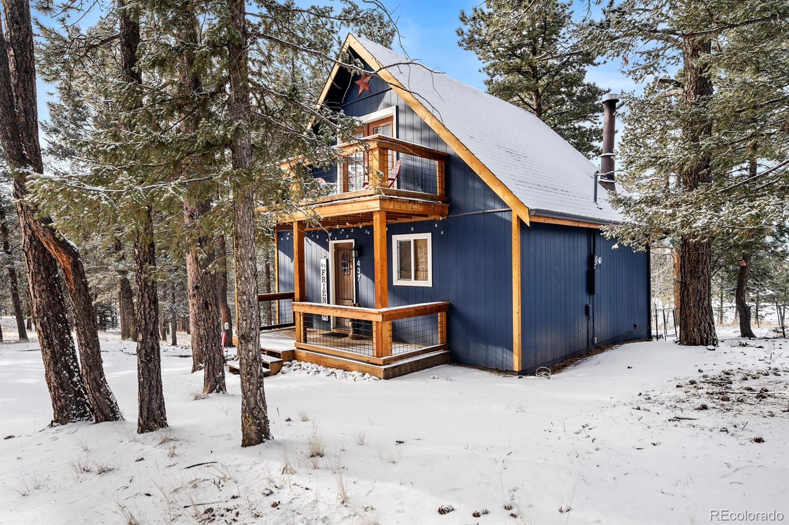 437 Kutsu Ridge Road Florissant, CO 80816 - Photo 17 of 24 a front view of a house with a yard covered in snow