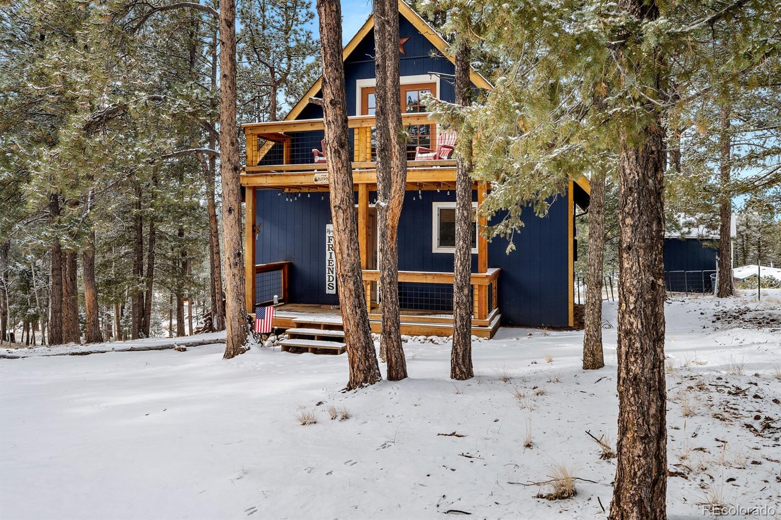 437 Kutsu Ridge Road Florissant, CO 80816 - Photo 24 of 24 a front view of a house with a yard