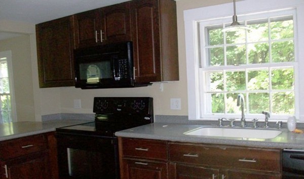 292 Princeton Road Sterling, MA 01564 - Photo 6 of 13 a kitchen with a sink a window and cabinets