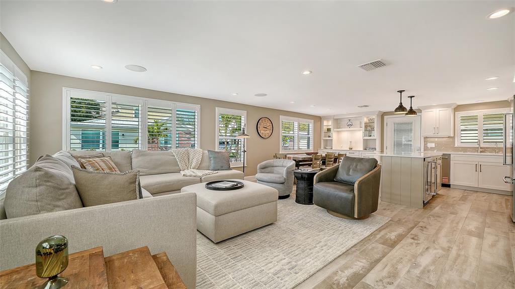 6140 Midnight Pass Road, Unit B6 Sarasota, FL 34242 - Photo 13 of 63 a living room with furniture and large windows