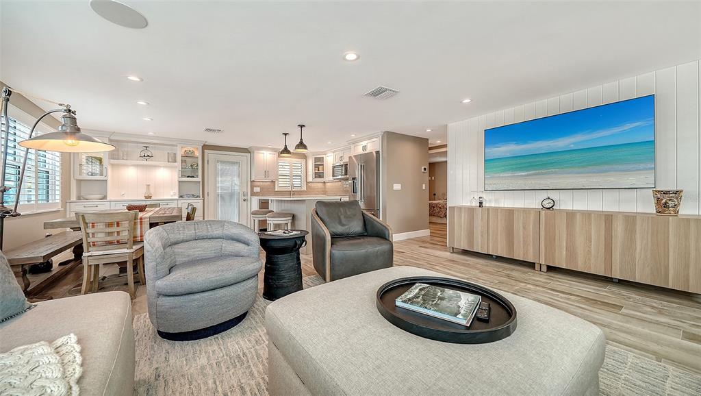 6140 Midnight Pass Road, Unit B6 Sarasota, FL 34242 - Photo 14 of 63 a living room with furniture and a wooden floor