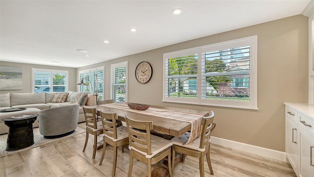 6140 Midnight Pass Road, Unit B6 Sarasota, FL 34242 - Photo 21 of 63 a view of a dining room with furniture and a large window