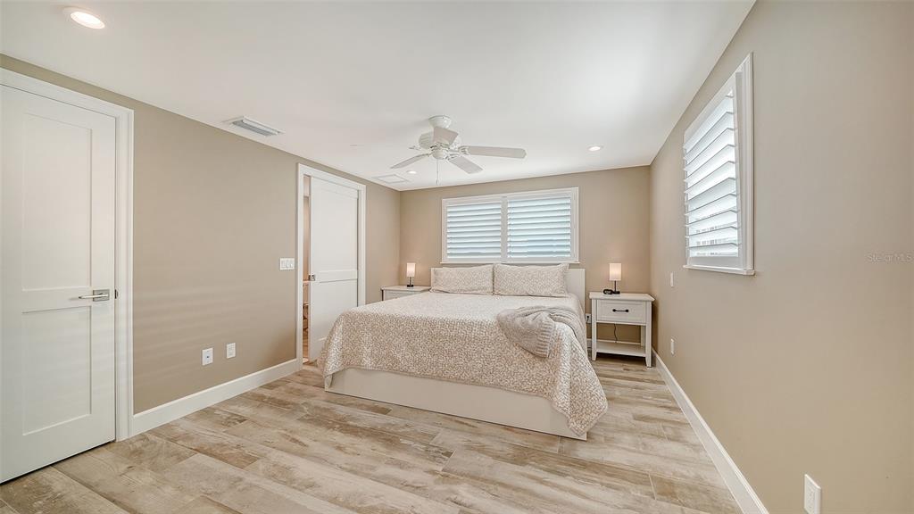 6140 Midnight Pass Road, Unit B6 Sarasota, FL 34242 - Photo 24 of 63 a bedroom with a bed and window