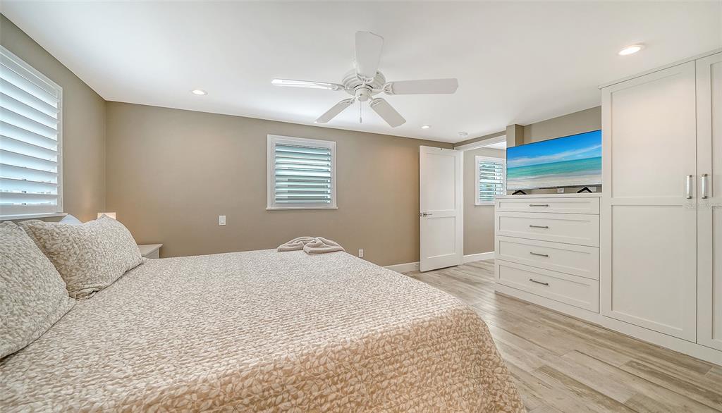 6140 Midnight Pass Road, Unit B6 Sarasota, FL 34242 - Photo 26 of 63 a bedroom with a bed and a window
