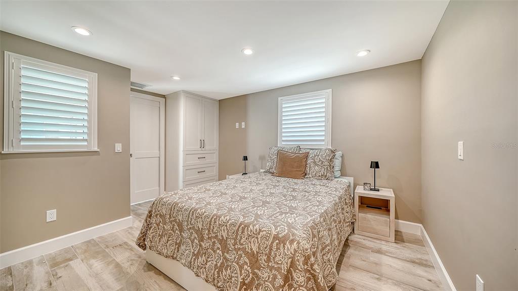 6140 Midnight Pass Road, Unit B6 Sarasota, FL 34242 - Photo 29 of 63 a bedroom with a bed and a window
