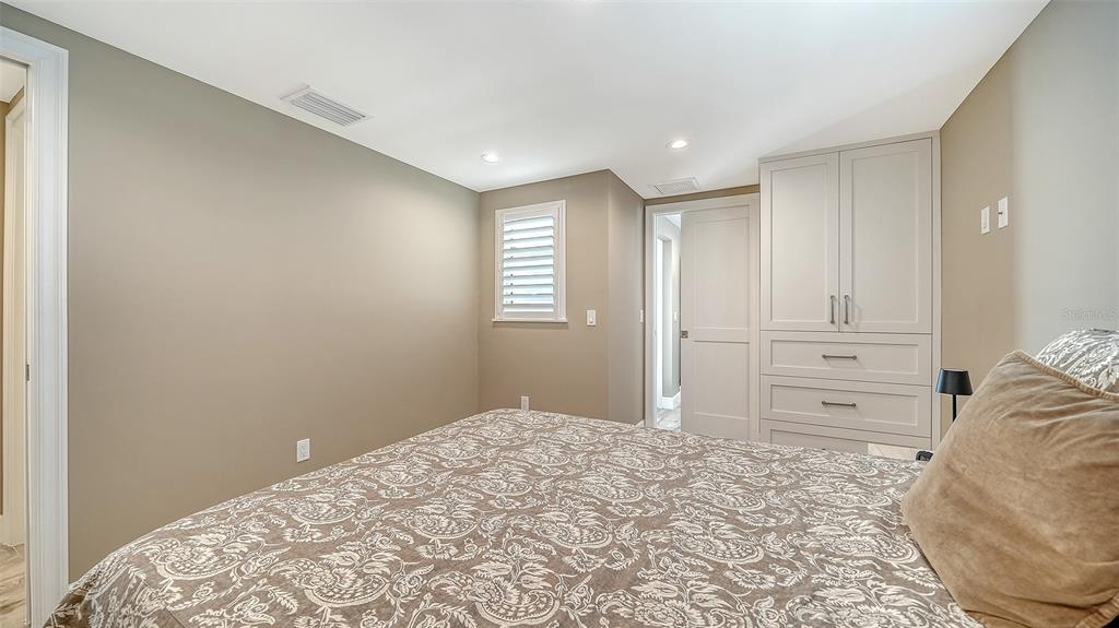 6140 Midnight Pass Road, Unit B6 Sarasota, FL 34242 - Photo 30 of 63 a bedroom with a bed and a window