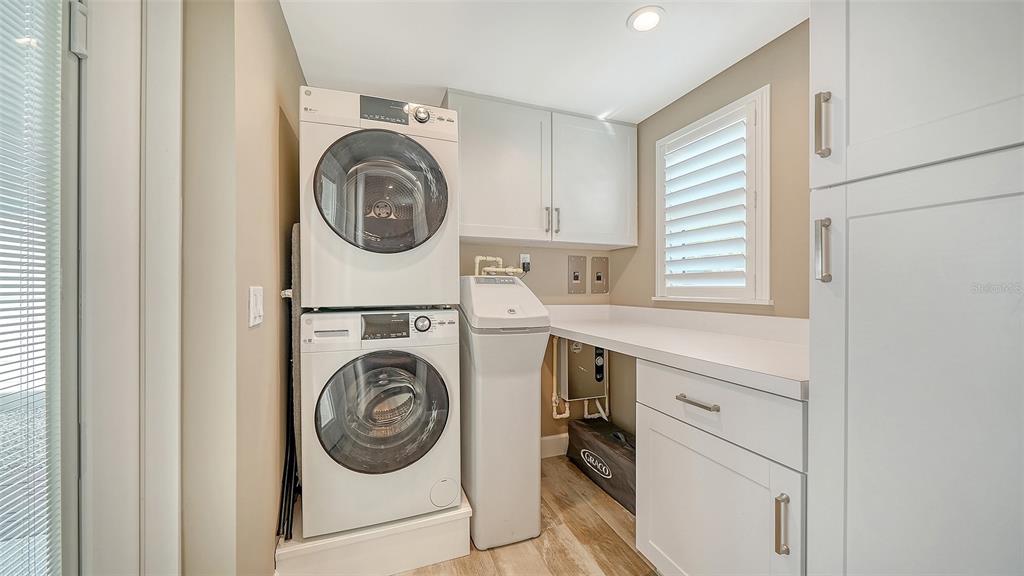 6140 Midnight Pass Road, Unit B6 Sarasota, FL 34242 - Photo 33 of 63 a utility room with dryer and washer