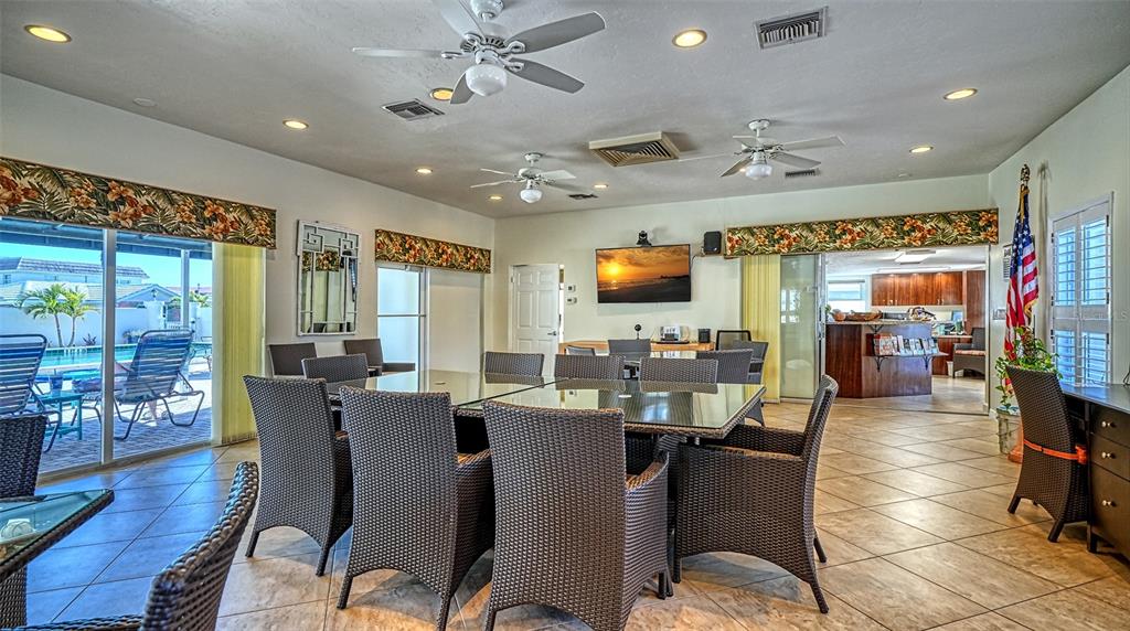 6140 Midnight Pass Road, Unit B6 Sarasota, FL 34242 - Photo 37 of 63 a view of a dining room with furniture window and wooden floor