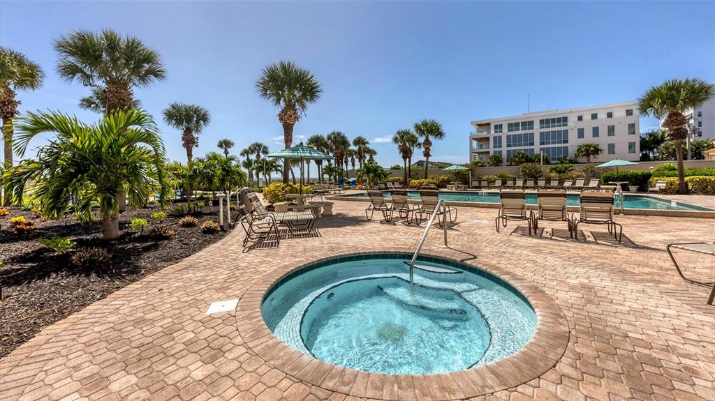 6140 Midnight Pass Road, Unit B6 Sarasota, FL 34242 - Photo 43 of 63 outdoor view of a swimming pool with outdoor seating