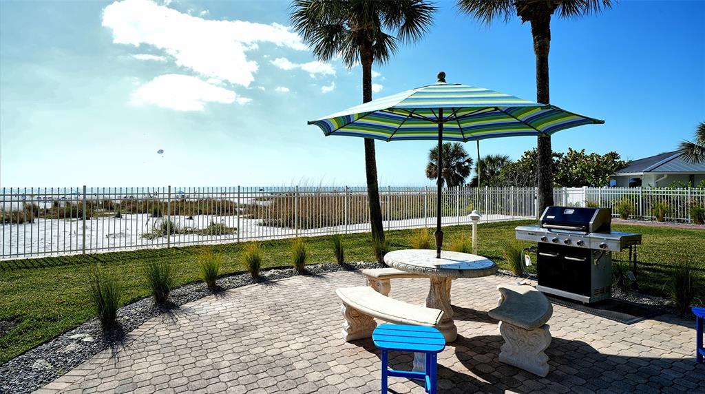 6140 Midnight Pass Road, Unit B6 Sarasota, FL 34242 - Photo 50 of 63 a view of a swimming pool with a patio