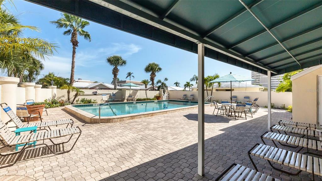 6140 Midnight Pass Road, Unit B6 Sarasota, FL 34242 - Photo 55 of 63 a view of a swimming pool with a patio