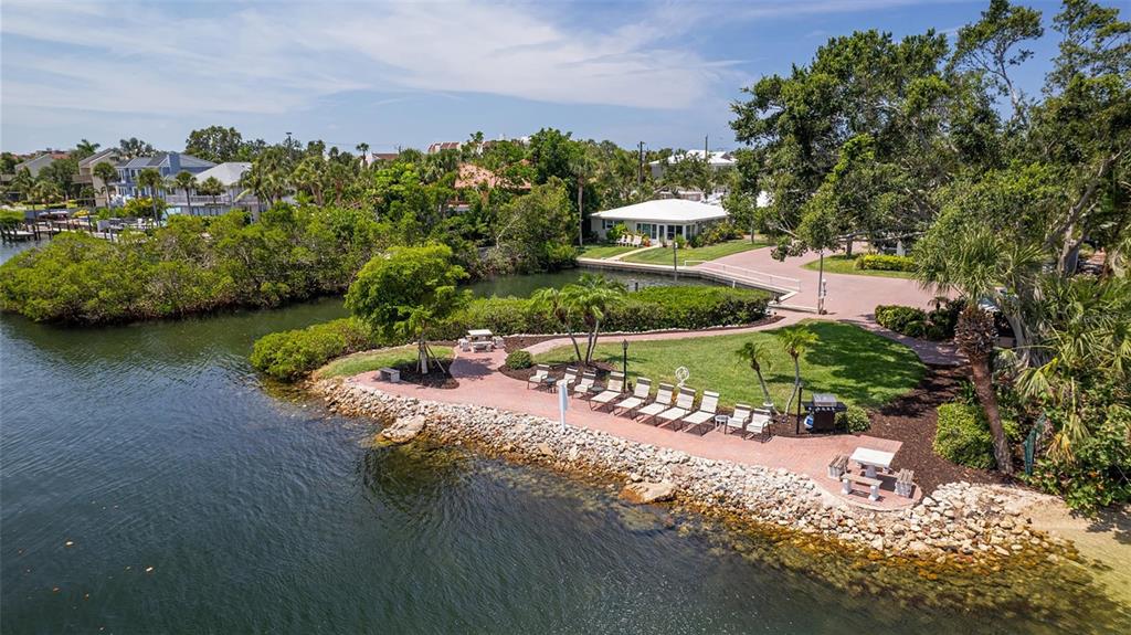 6140 Midnight Pass Road, Unit B6 Sarasota, FL 34242 - Photo 59 of 63 an aerial view of a house with a yard and lake view