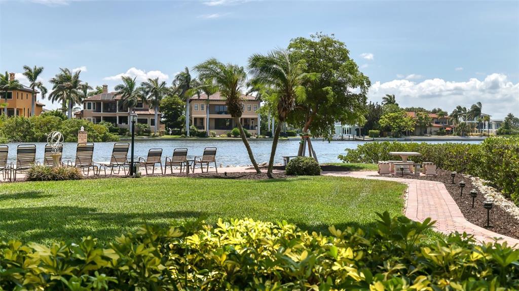 6140 Midnight Pass Road, Unit B6 Sarasota, FL 34242 - Photo 60 of 63 a view of a garden with a building in the background