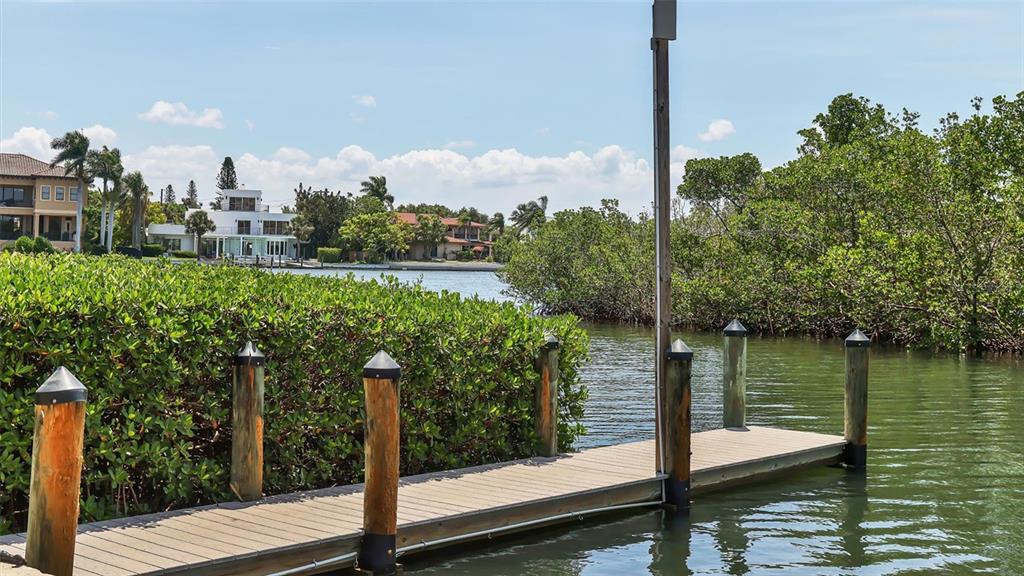 6140 Midnight Pass Road, Unit B6 Sarasota, FL 34242 - Photo 63 of 63 a view of a lake from a balcony