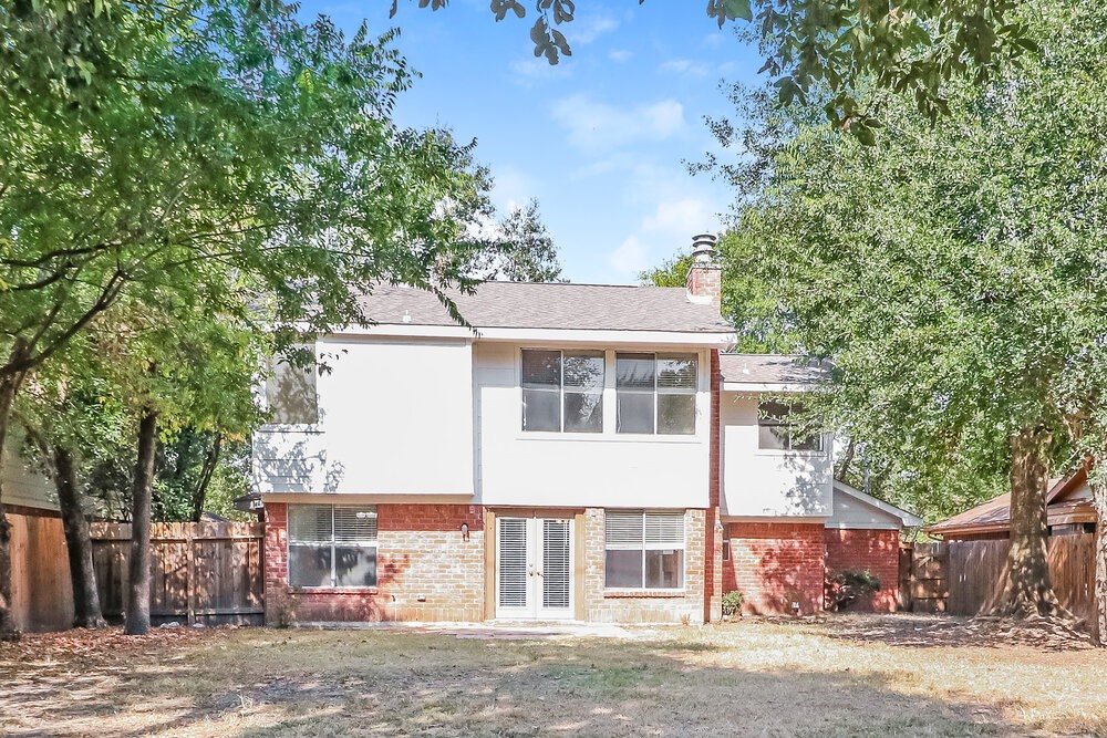 7811 Goldengrove Drive Spring, TX 77379 - Photo 17 of 17 a front view of a house with a garden