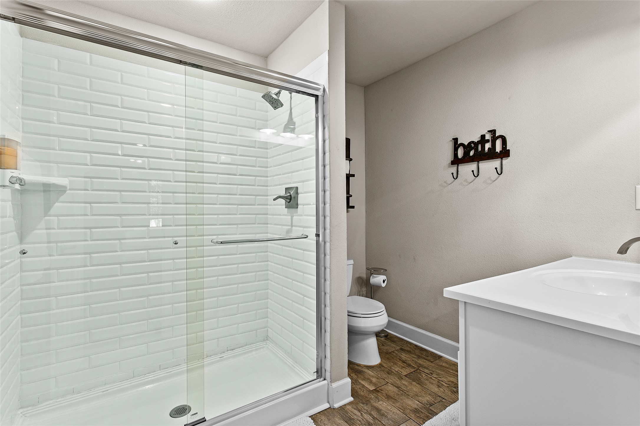 200 Creek Road Dripping Springs, TX 78620 - Photo 17 of 40 a bathroom with a toilet and a shower