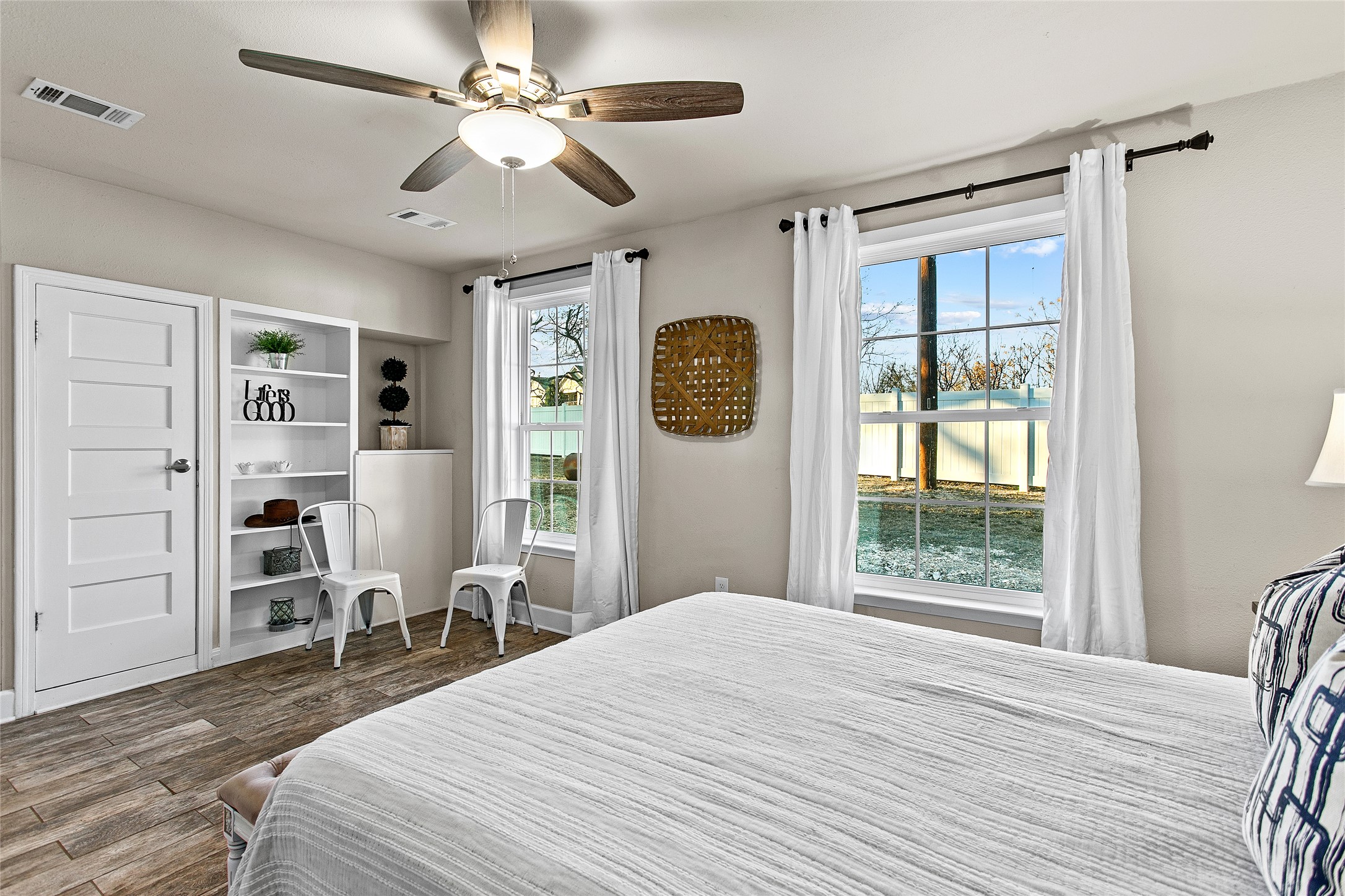 200 Creek Road Dripping Springs, TX 78620 - Photo 20 of 40 a bedroom with a bed dresser and a window