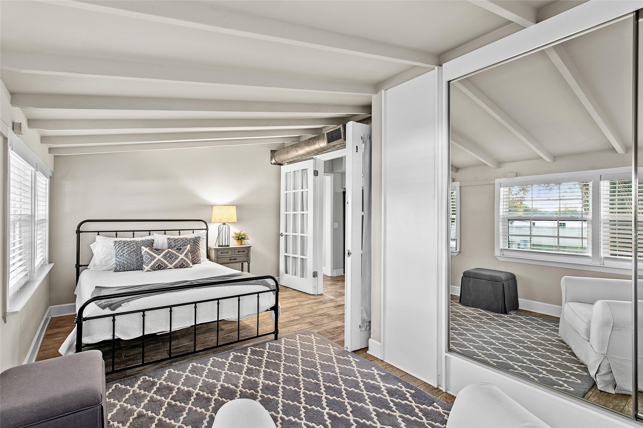 200 Creek Road Dripping Springs, TX 78620 - Photo 24 of 40 a bedroom with furniture and a window