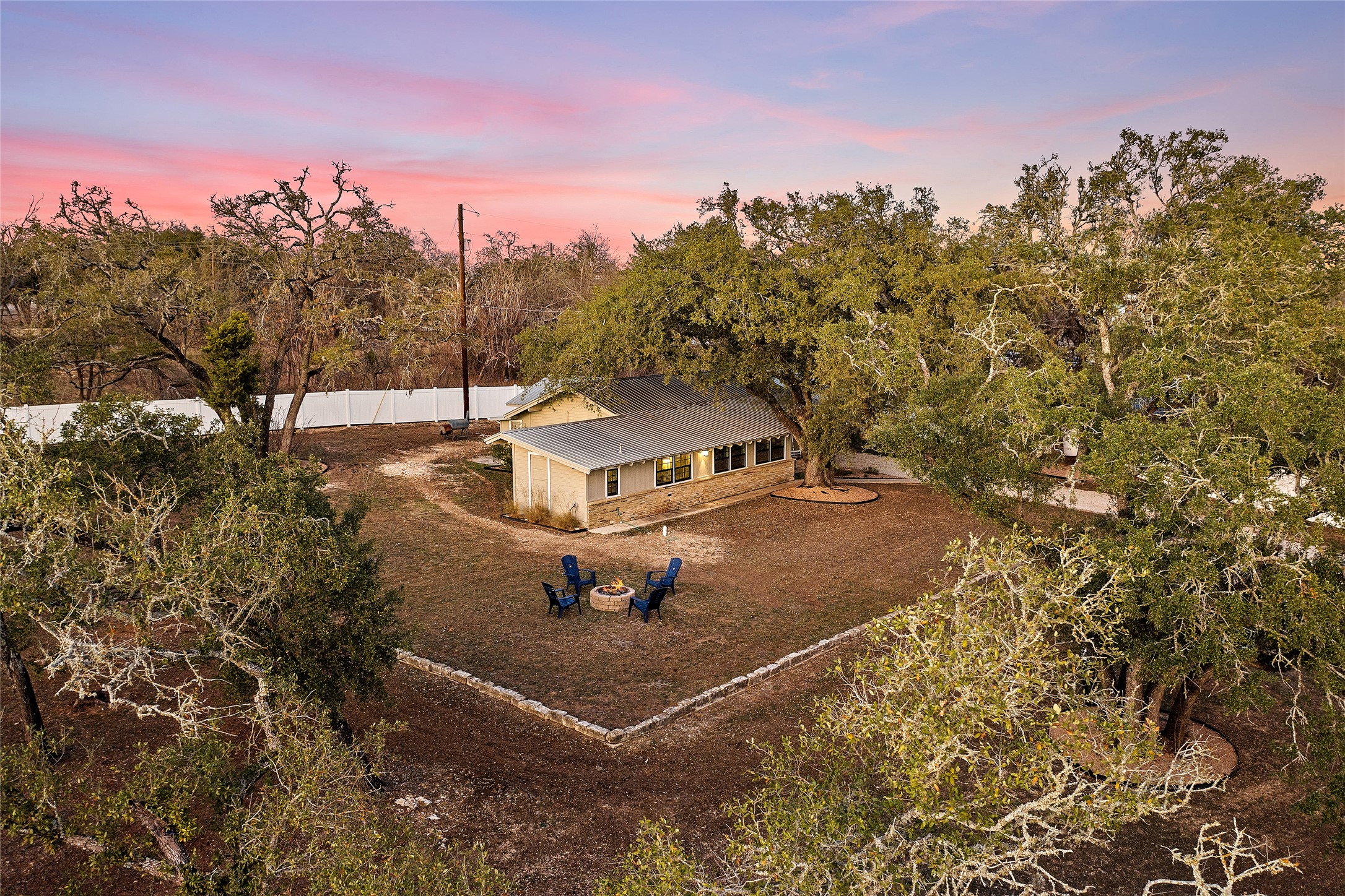 200 Creek Road Dripping Springs, TX 78620 - Photo 32 of 40 a view of a house with a yard