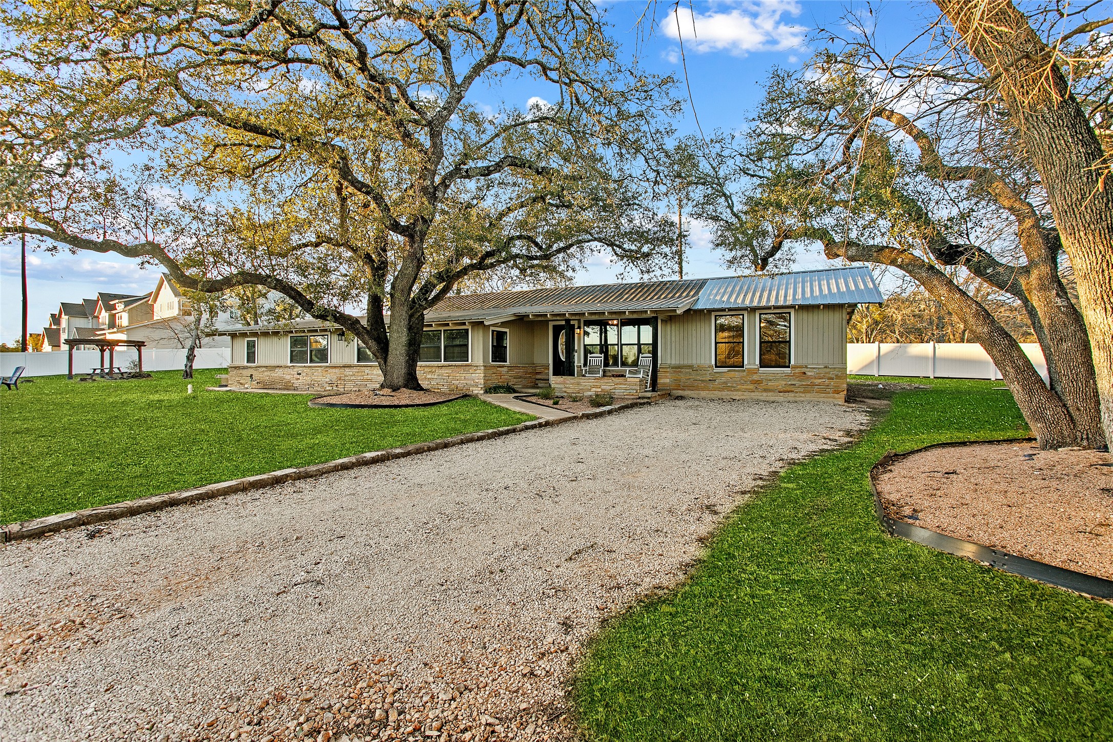 200 Creek Road Dripping Springs, TX 78620 - Photo 34 of 40 a front view of a house with a yard