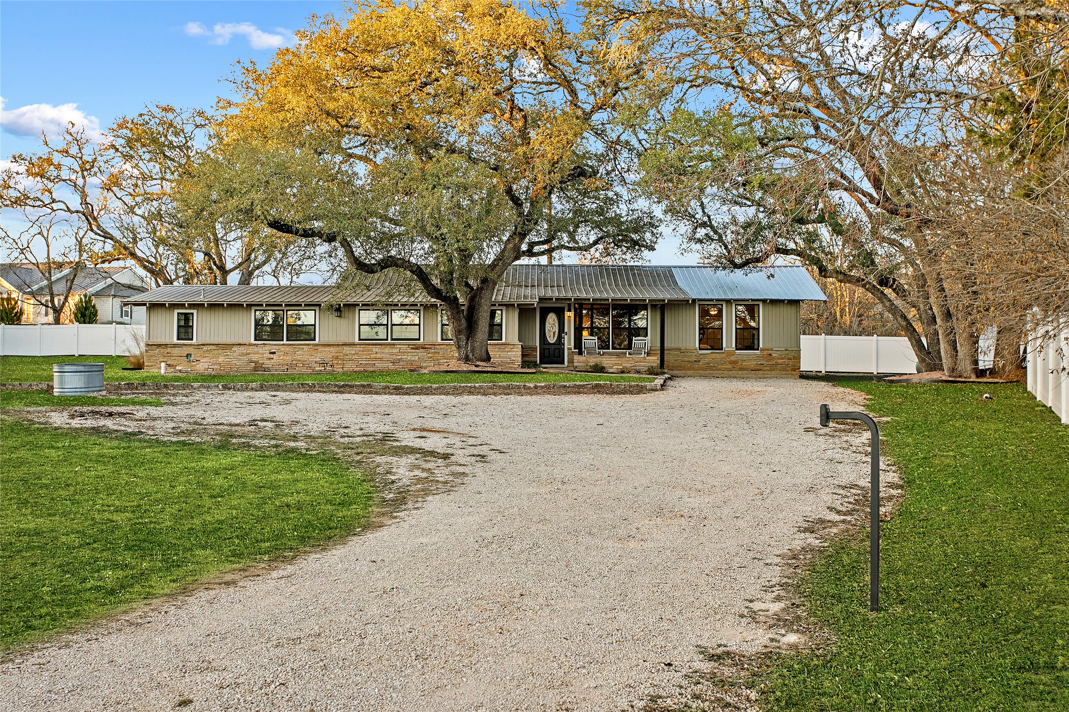 200 Creek Road Dripping Springs, TX 78620 - Photo 36 of 40 a front view of a house with a yard