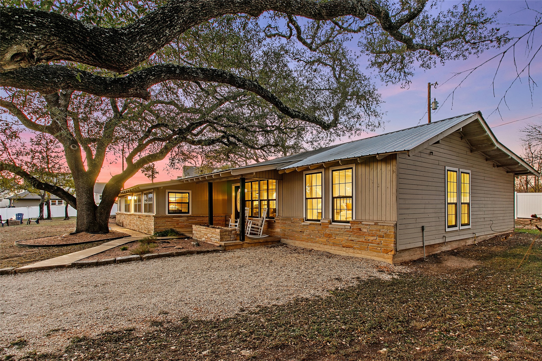 200 Creek Road Dripping Springs, TX 78620 - Photo 37 of 40 a front view of a house with a yard